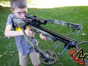 boy shooting crossbow